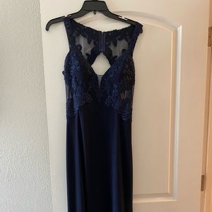 Gorgeous deep navy floor length gown. It has been hung and in bag since purchase